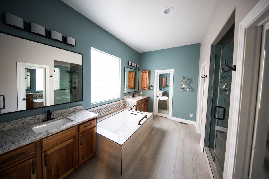 Professional contractor reviewing bathroom remodeling plans