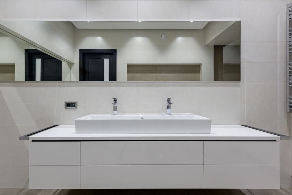 Modern bathroom vanity sink and new bathtub installation
